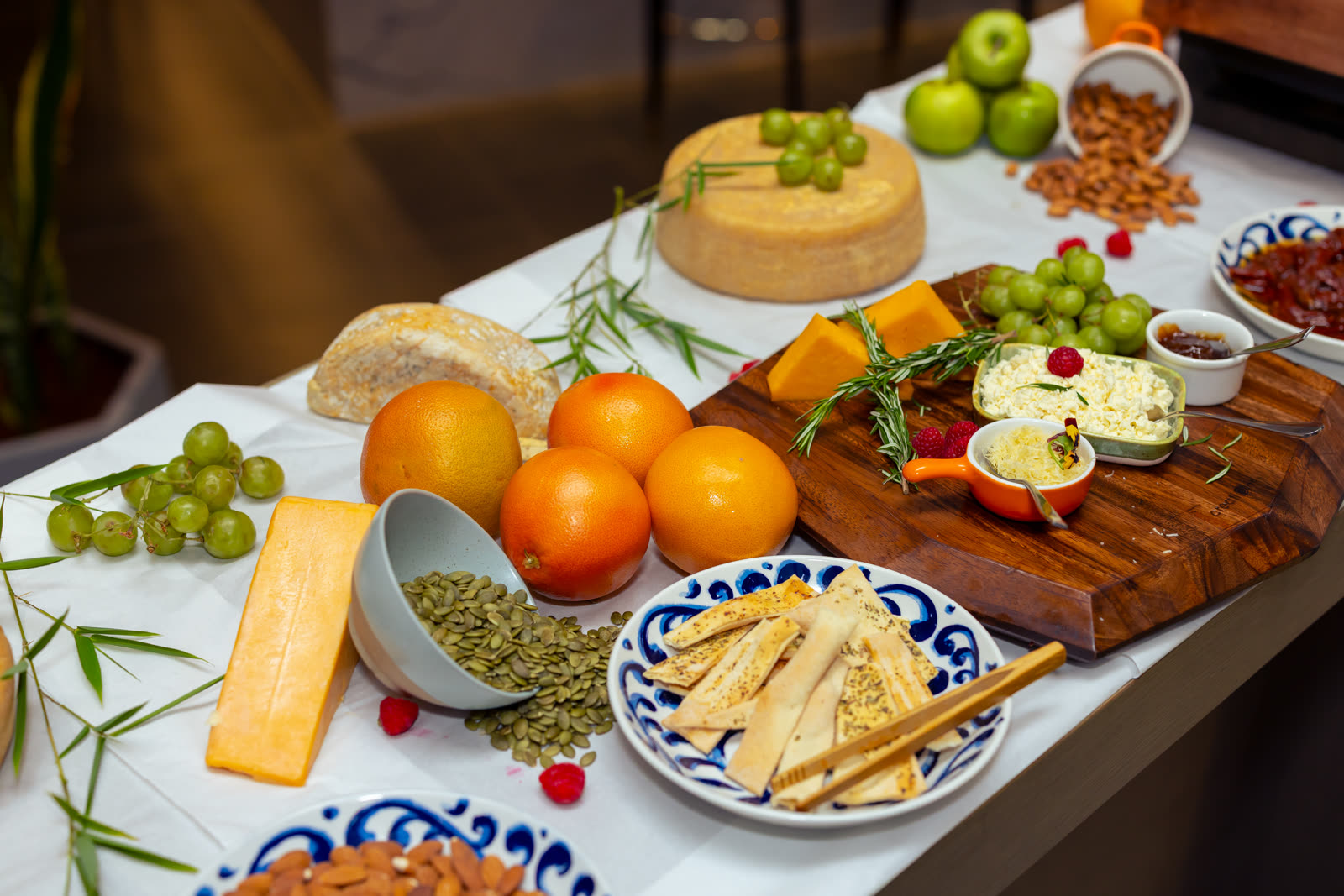 Event tablescape styling with cheese, fruit, and grazing spread